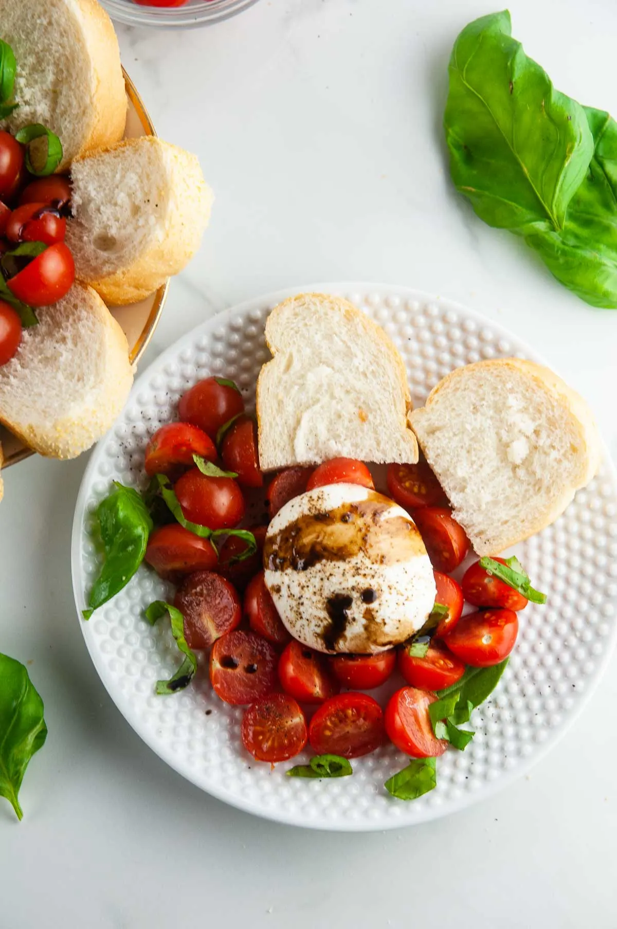 Burrata caprese salad takes the classic flavors of the tomato, mozzarella, and basil combination and turns it up a notch with decadent burrata cheese. This easy variation of caprese with burrata makes for an effortlessly elegant dinner or appetizer anytime.