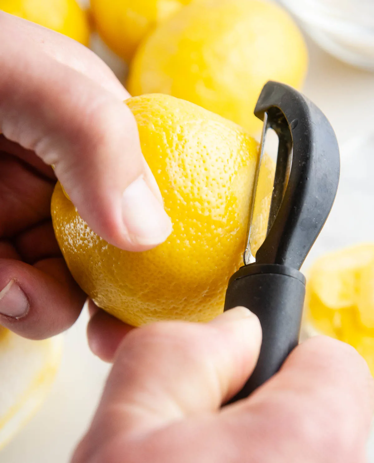 Taking care not to remove the white part of the peel (the pith) is key to making homemade limoncello