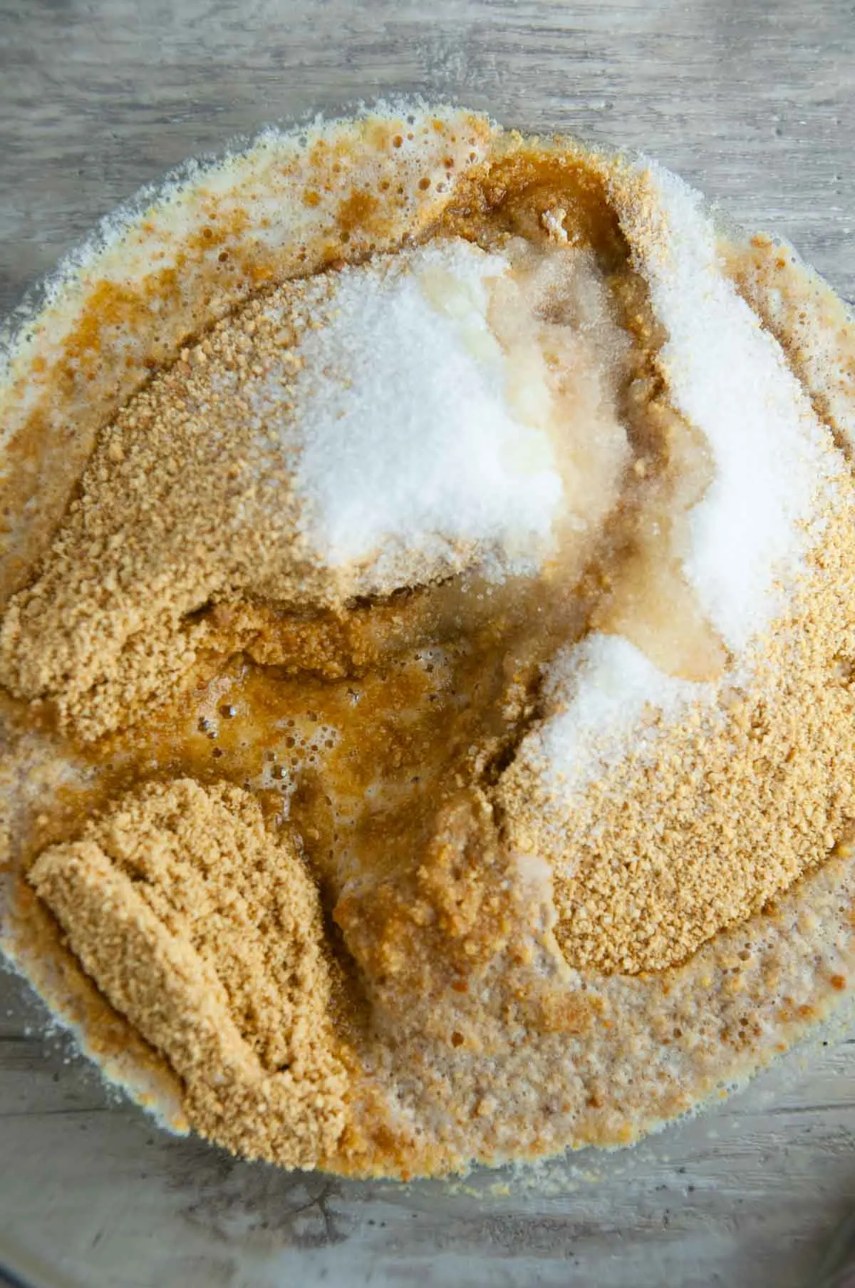 Add the ingredients for graham cracker crust to the bowl of a food processor
