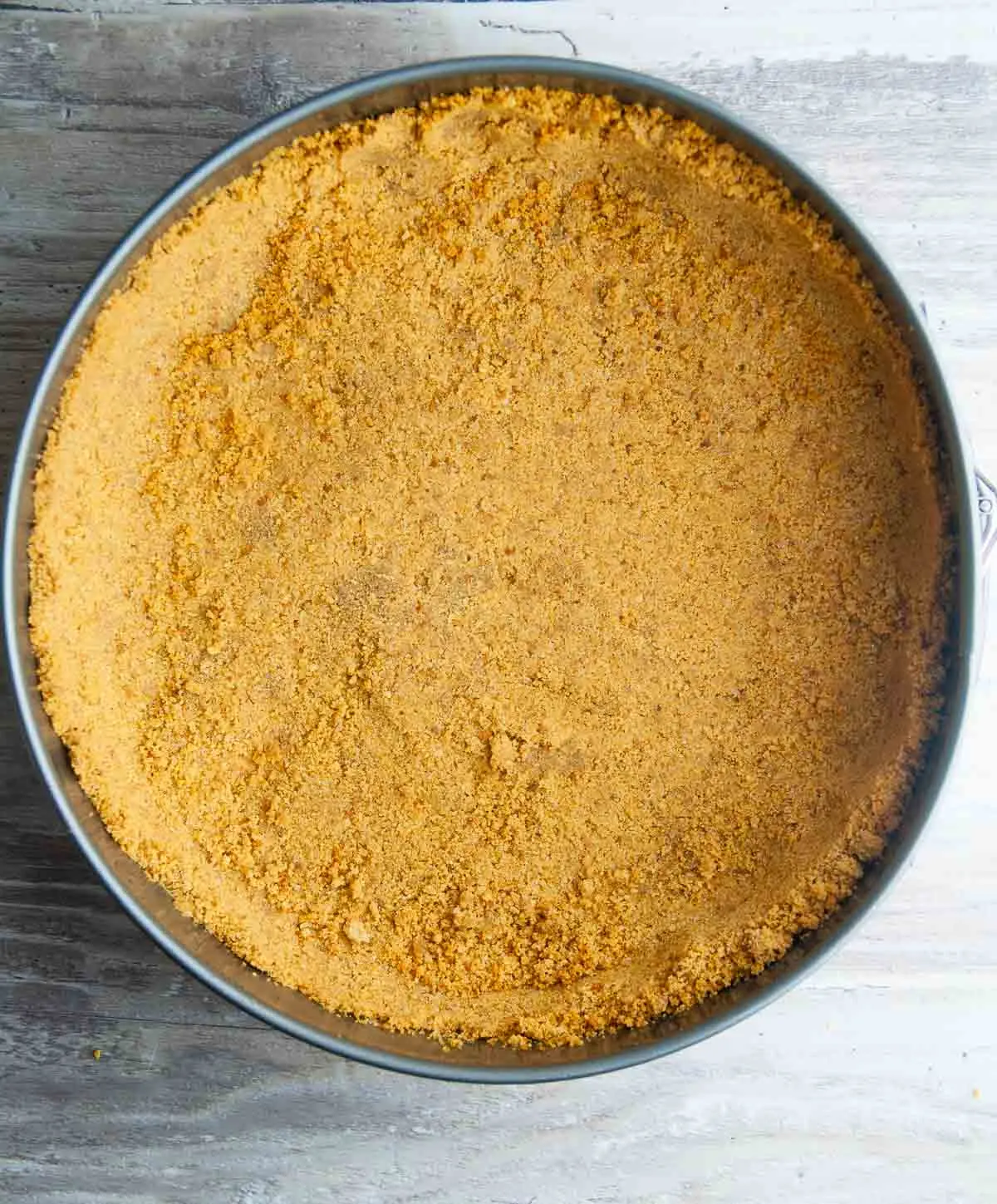 Baked graham cracker crust ready to be fillied