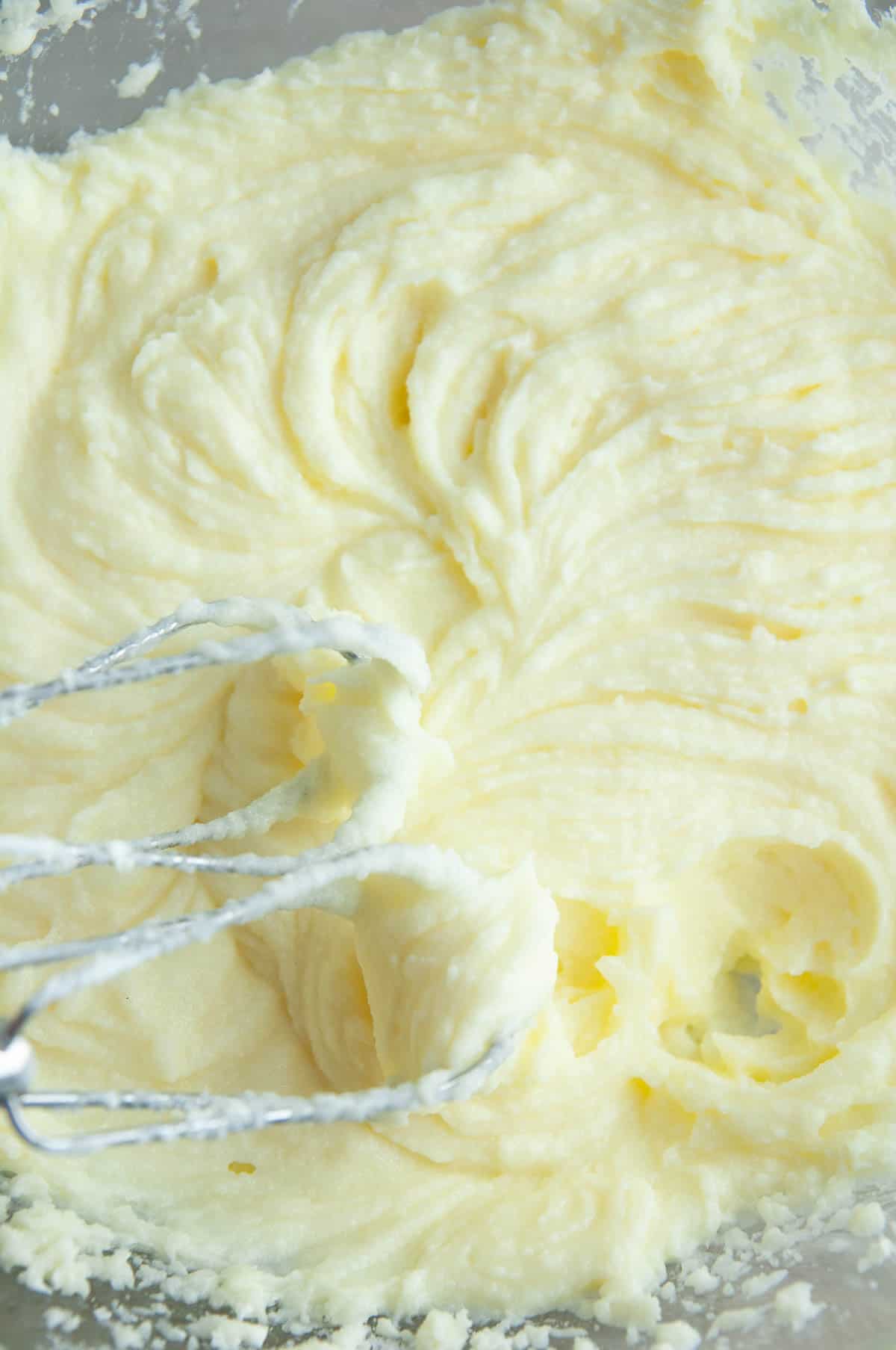 Beat the mascarpone cheese, ricotta cheese, and sugar together until fluffy