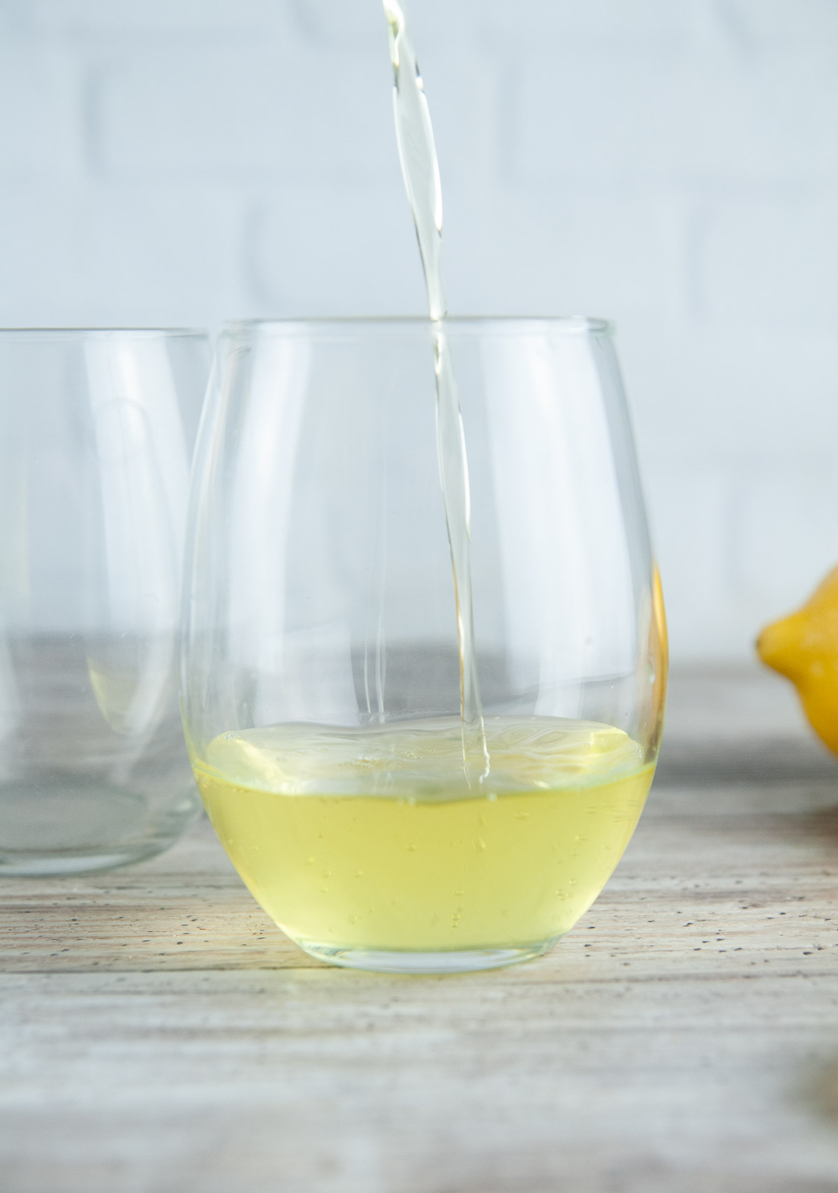 Pour chilled limoncello into a glass.