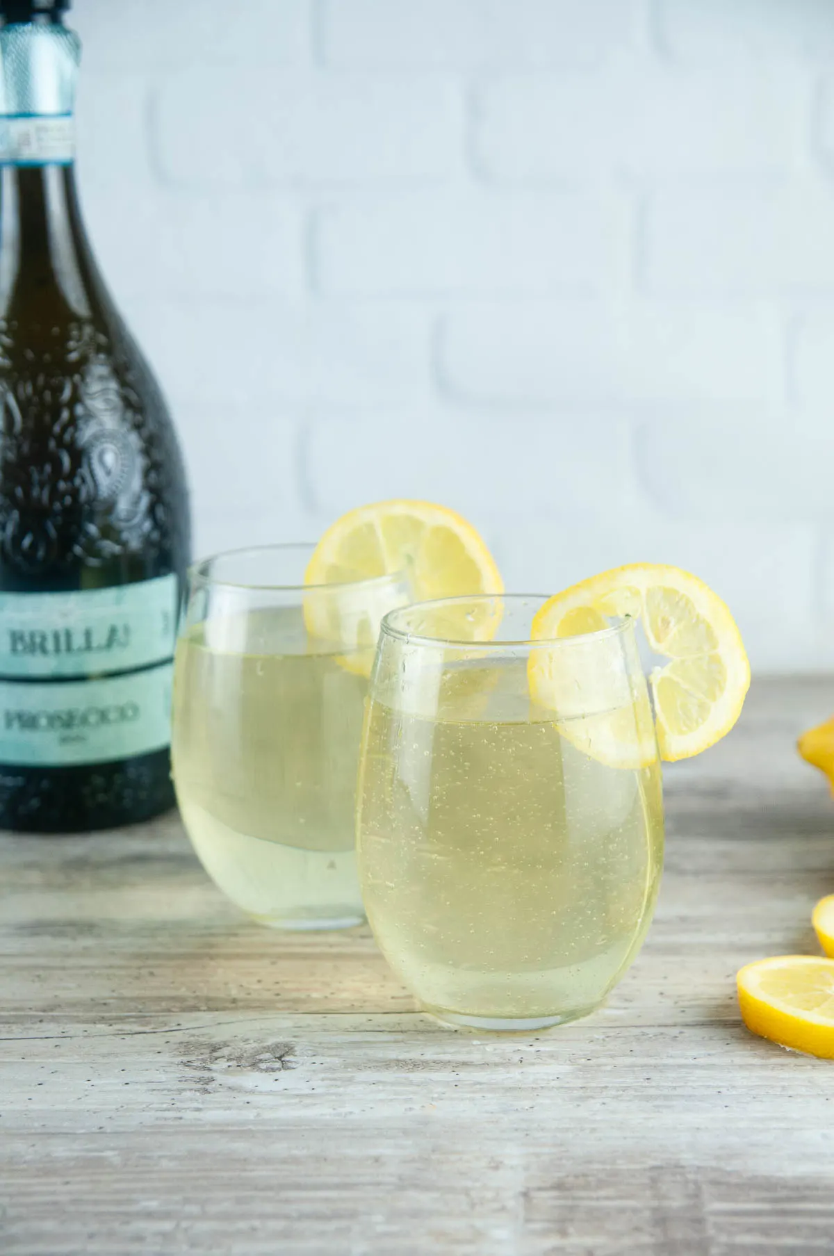 This limoncello spritz recipe will transport your tastebuds to the sundrenched Italian coasts with its bright flavor and fun bubbles. With limoncello, Prosecco, and a splash of fizzy soda, these limoncello cocktails are perfect for summer sipping or even celebrating the holidays!