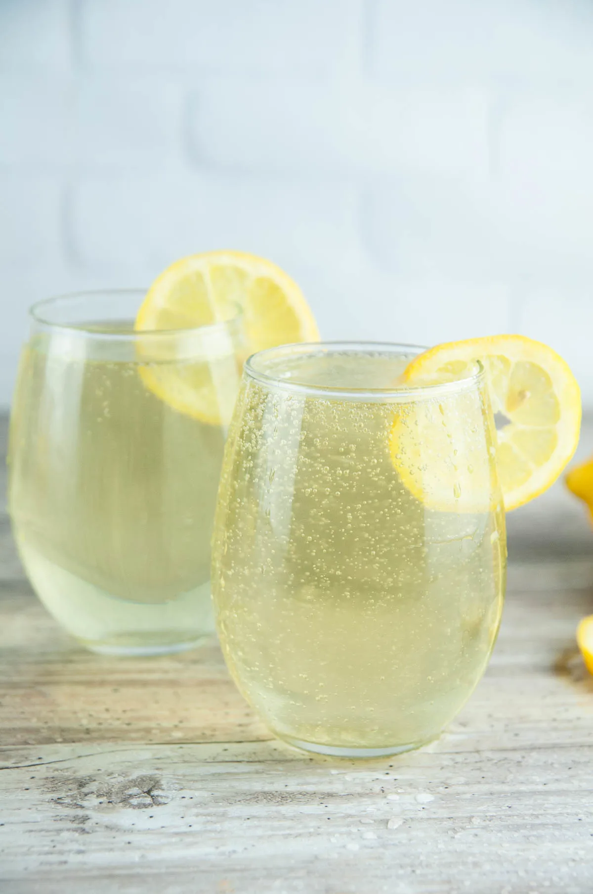 This limoncello spritz recipe will transport your tastebuds to the sundrenched Italian coasts with its bright flavor and fun bubbles. With limoncello, Prosecco, and a splash of fizzy soda, these limoncello cocktails are perfect for summer sipping or even celebrating the holidays!