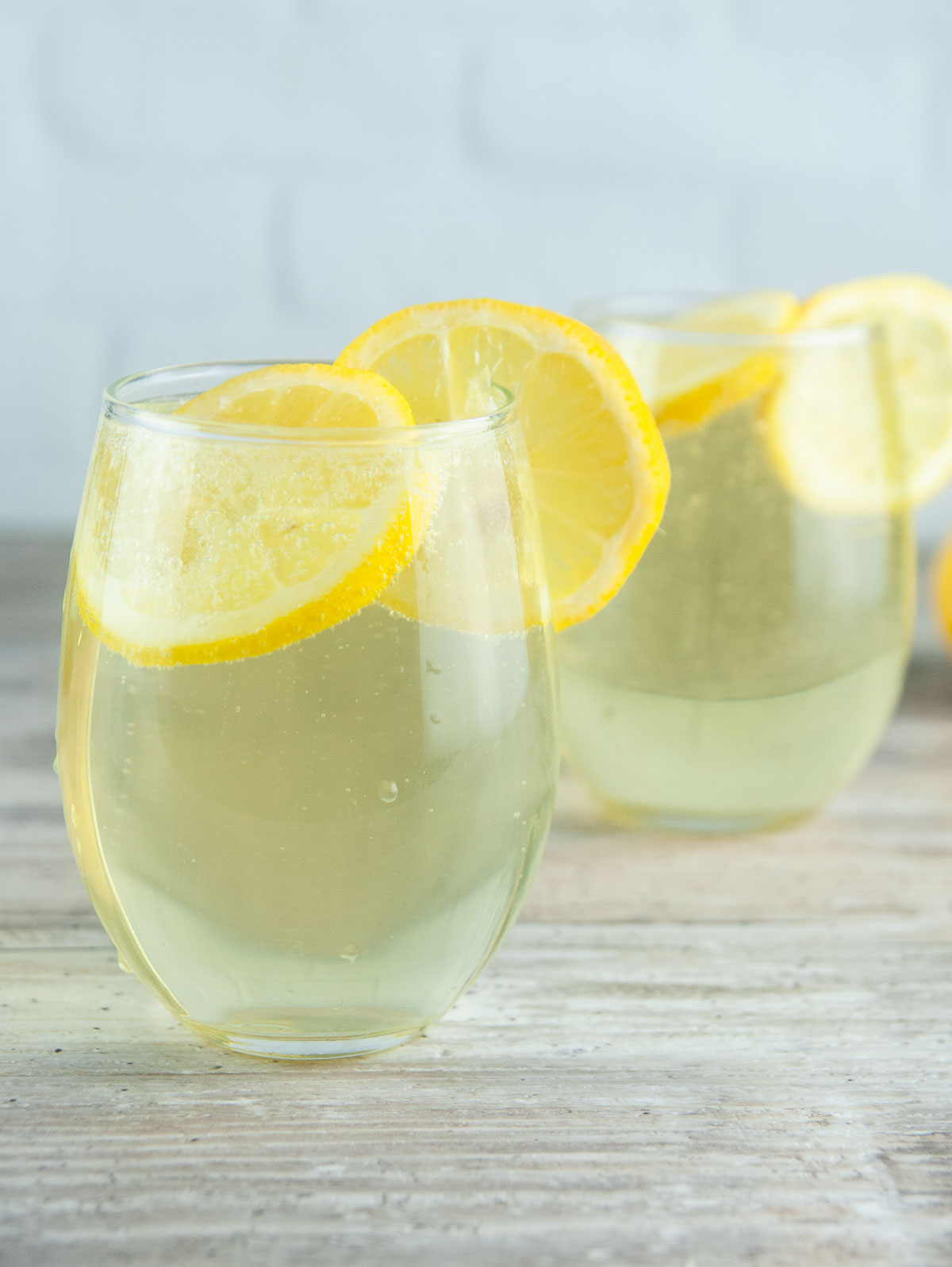 This limoncello spritz recipe will transport your tastebuds to the sundrenched Italian coasts with its bright flavor and fun bubbles. With limoncello, Prosecco, and a splash of fizzy soda, these limoncello cocktails are perfect for summer sipping or even celebrating the holidays!