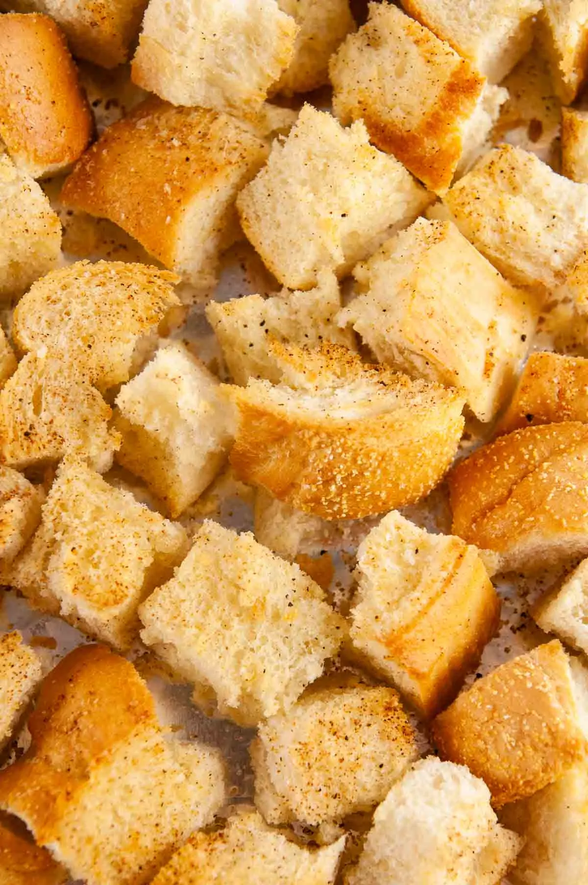 Toss the bread cubes with olive oil and toast it in the oven.