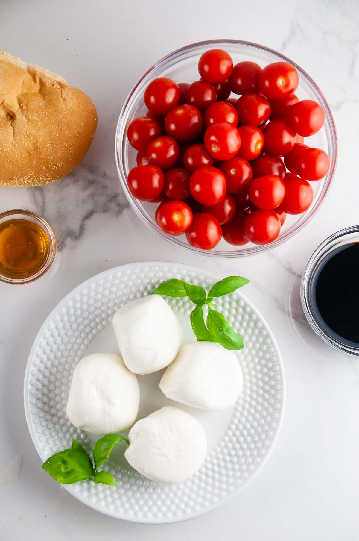 Ingredients for Buratta Panzanella Salad: Tomatoes, Burrata, Bread, Balsamic, Honey, and Basil