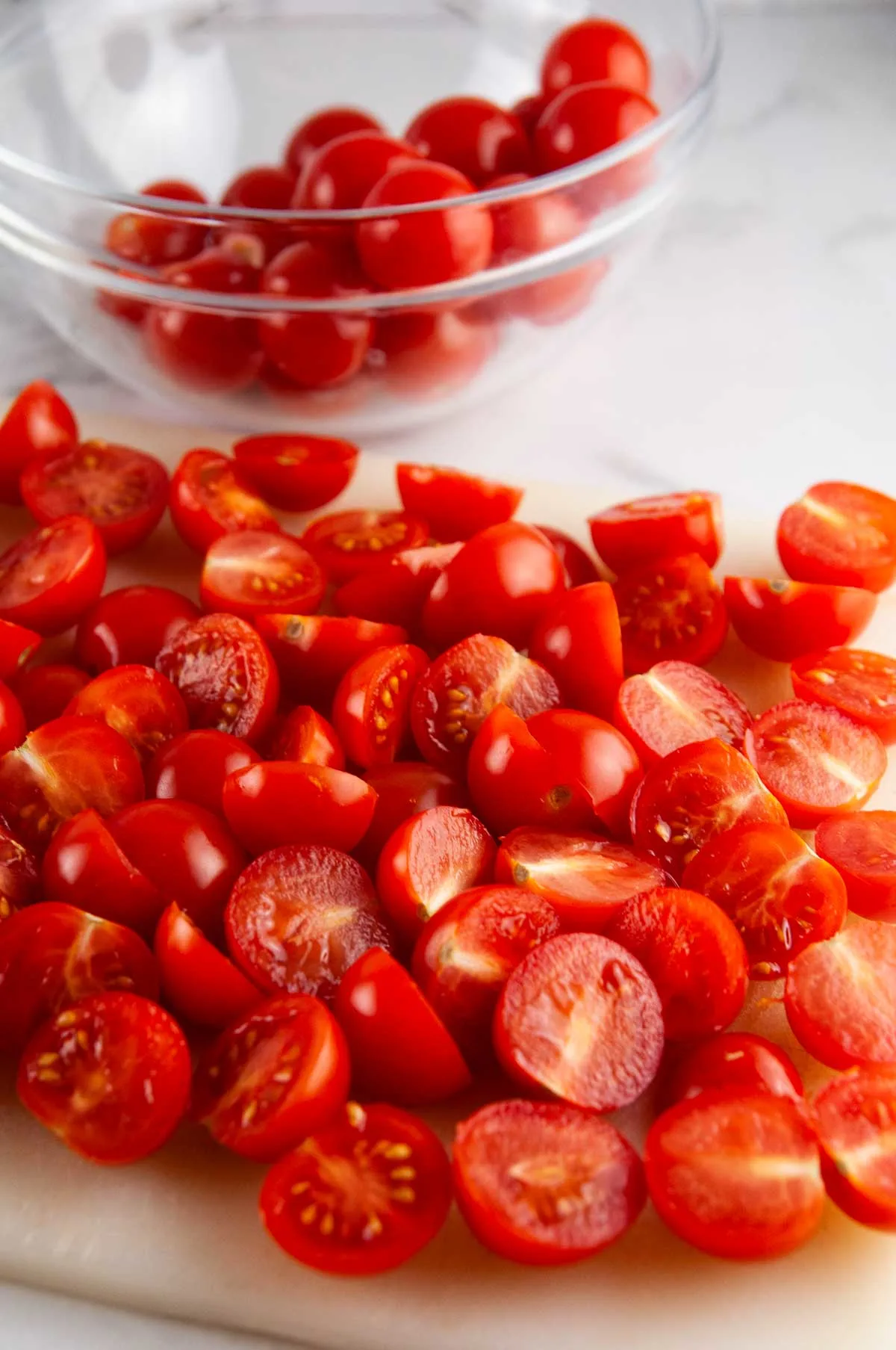 Halve the cherry tomatoes.
