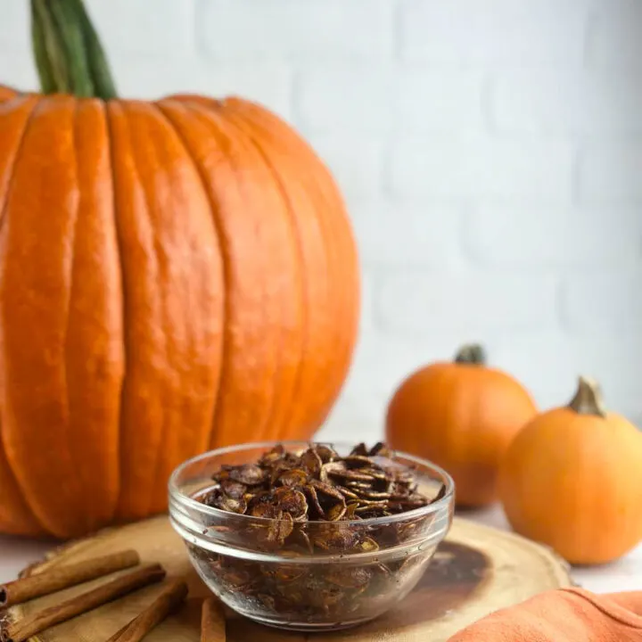 Honey roasted pumpkin seeds are an easy way to make use of the seeds from your Halloween pumpkin. Pumpkin seeds get tossed with olive oil, sweet honey, cinnmon, and sea salt for a yummy snack or topping!