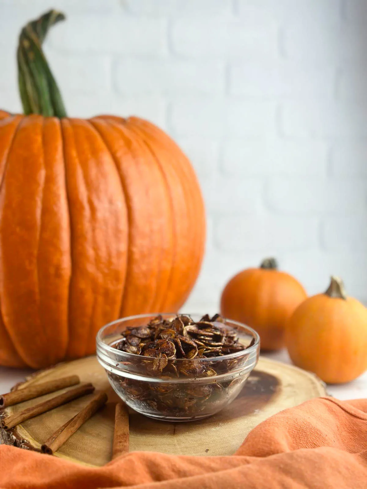 Honey roasted pumpkin seeds are an easy way to make use of the seeds from your Halloween pumpkin. Pumpkin seeds get tossed with olive oil, sweet honey, cinnmon, and sea salt for a yummy snack or topping!