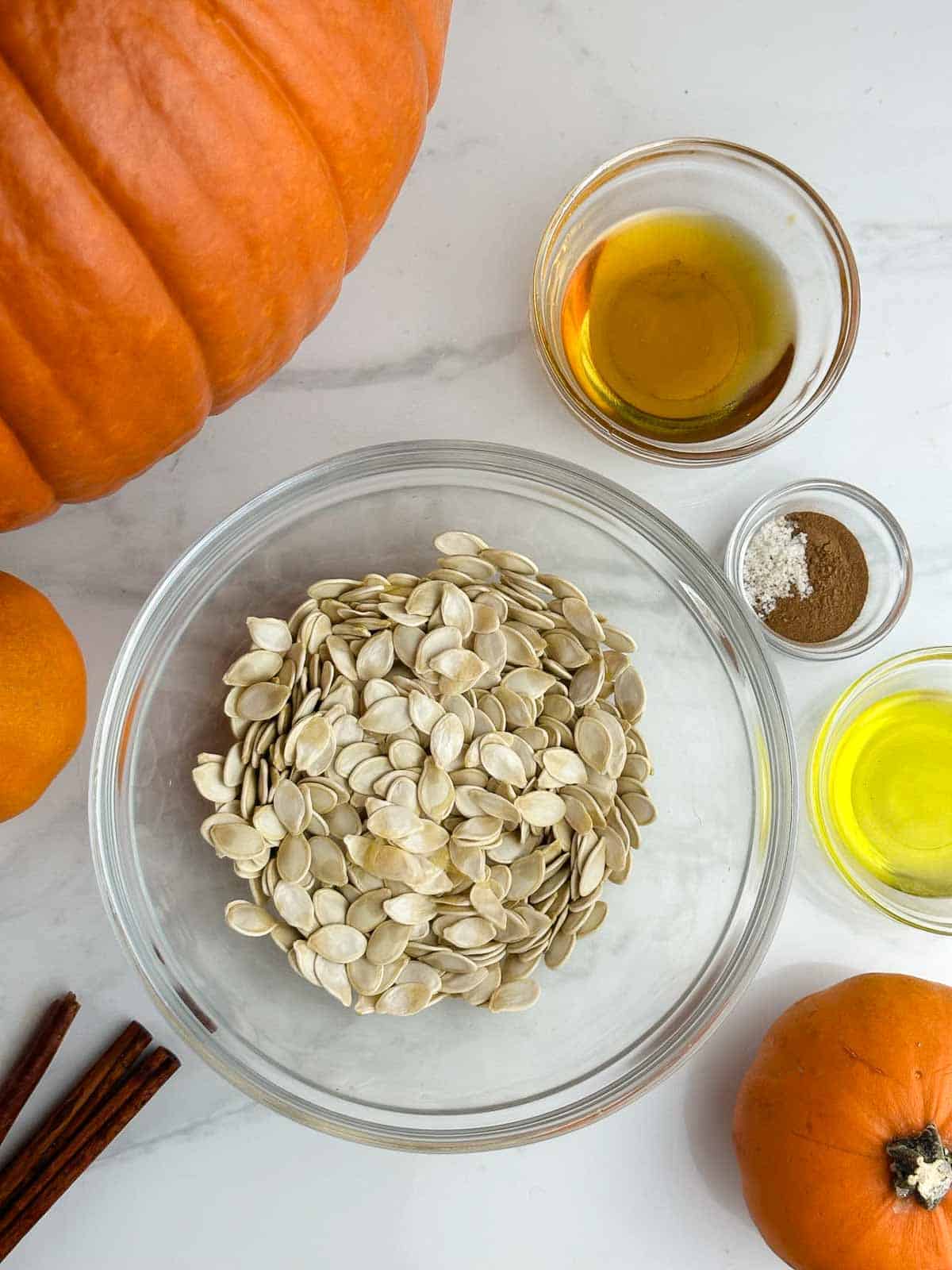 Ingredients for honey roasted pumpkin seeds: pumpkin seeds, honey, cinnamon, sea salt, and olive oil