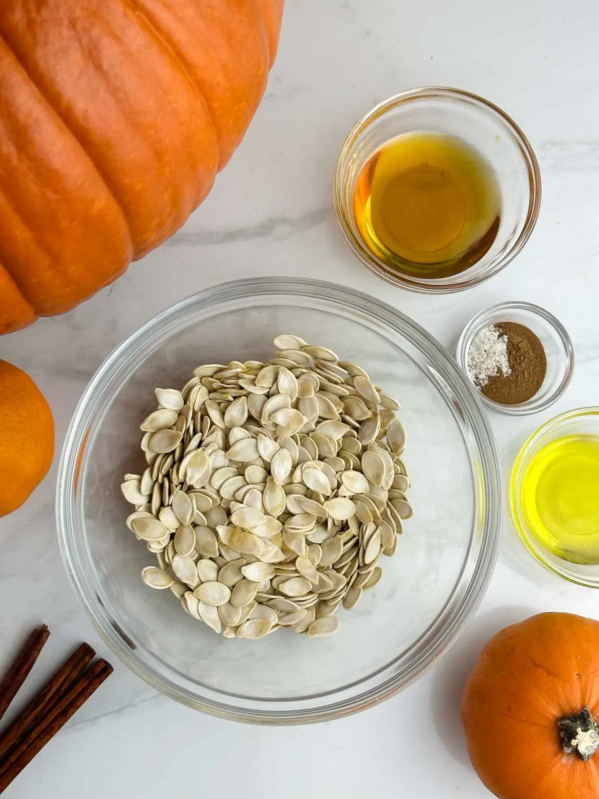 Ingredients for honey roasted pumpkin seeds: pumpkin seeds, honey, cinnamon, sea salt, and olive oil