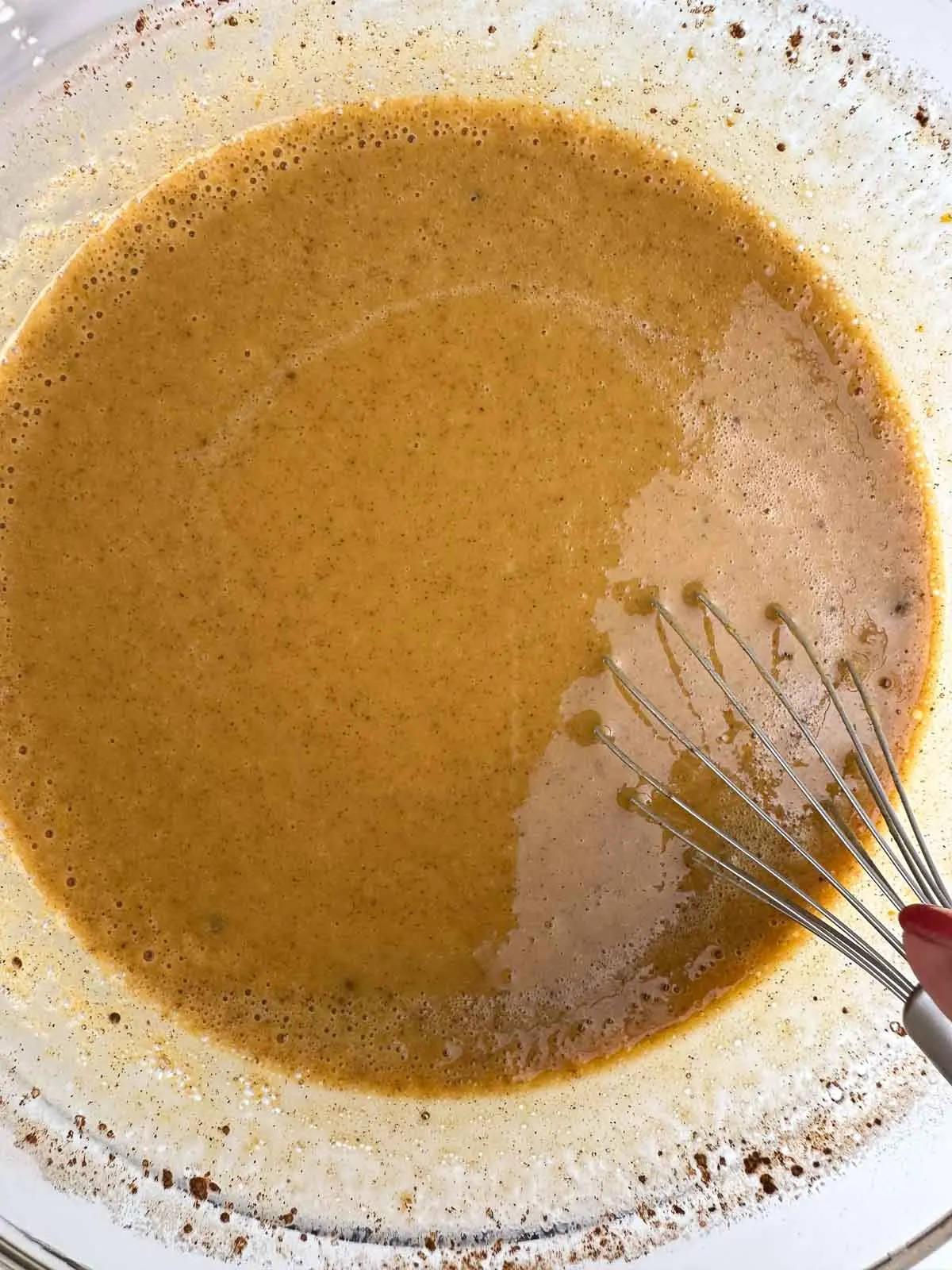 The pumpkin pie filling should be smoothly combined before you pour it into the graham cracker crust.