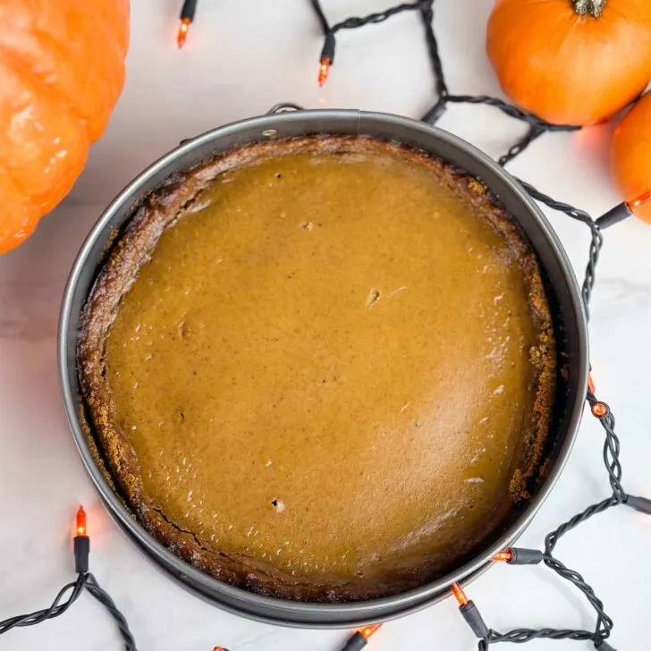 Pumpkin pie with graham cracker crust is a lovely holiday dessert with creamy pumpkin custard on top of crunchy graham crust.