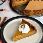 Pumpkin pie with graham cracker crust is a lovely holiday dessert with creamy pumpkin custard on top of crunchy graham crust.