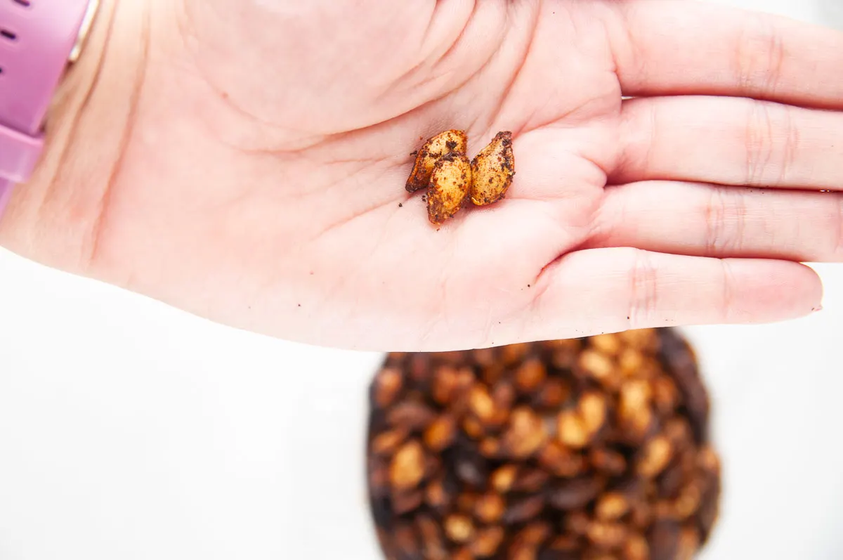 This easy roasted butternut squash seeds recipe creates a savory crunchy snack or topping for fall and winter salads and soups. You'll never throw the seeds away again after you taste these!