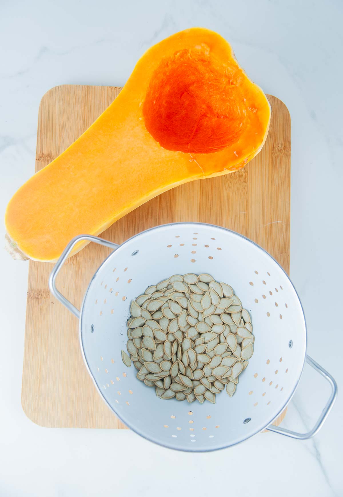 Rinse the butternut squash seeds until they are clean.