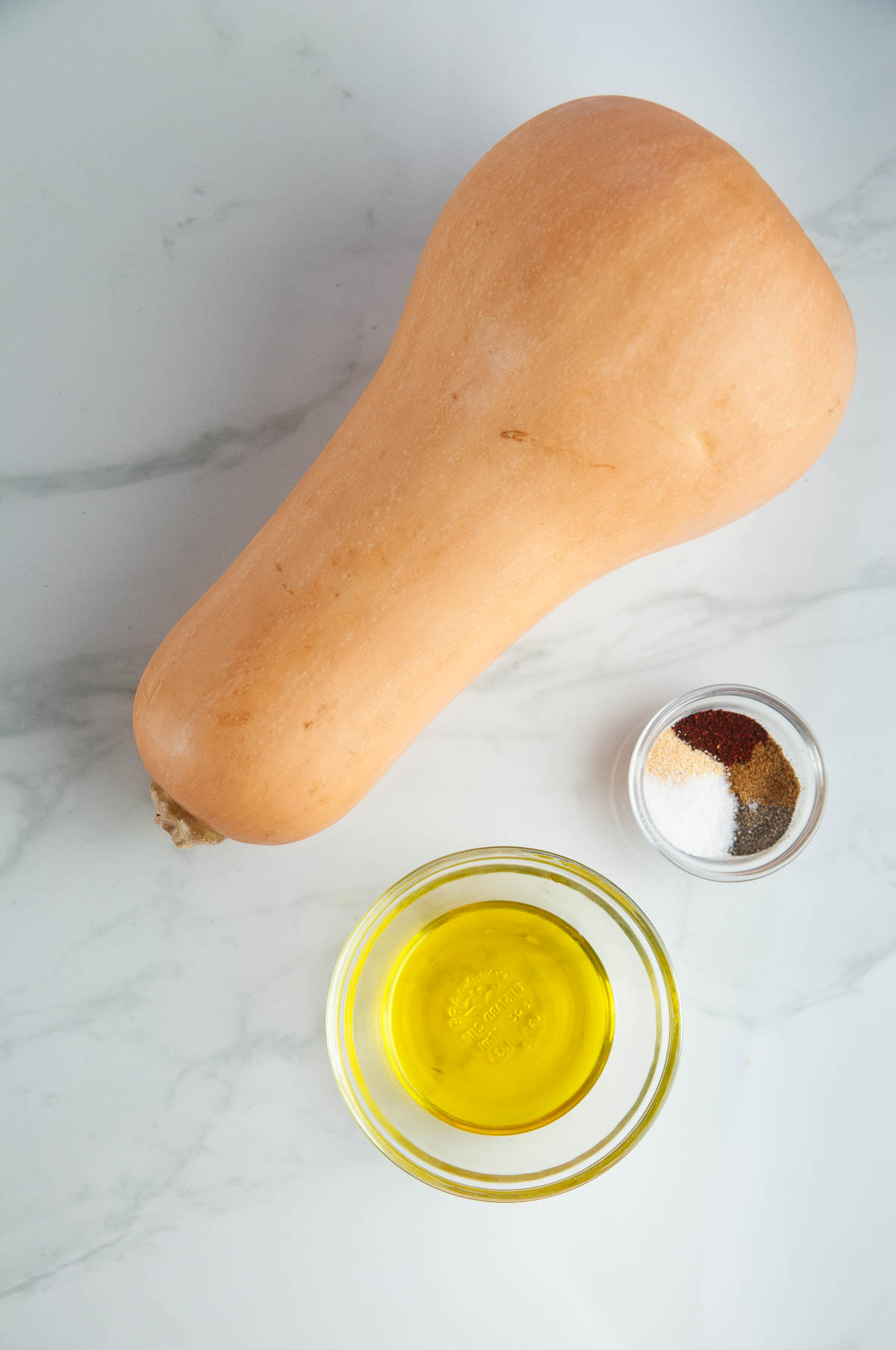 Ingredients for Savory Spiced Butternut Squash: Butternut Squash, Garlic Powder, Cumin, Chili Powder, Salt and Pepper, and Olive Oil