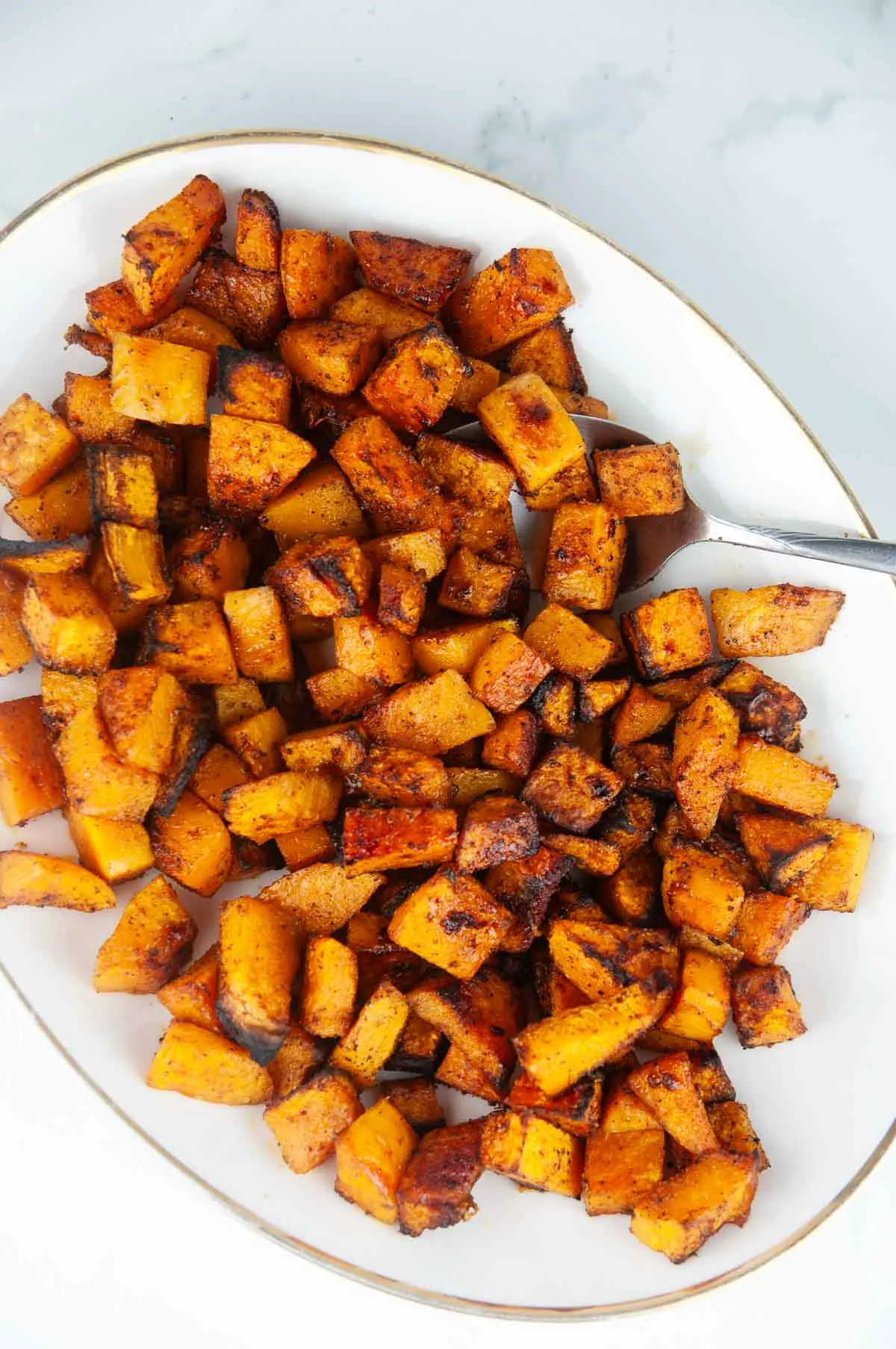 Roasted spice butternut squash is a savory butternut squash recipe with bold flavors like chili powder and garlic. This is a standout variation on traditional sweet roasted squash recipes!