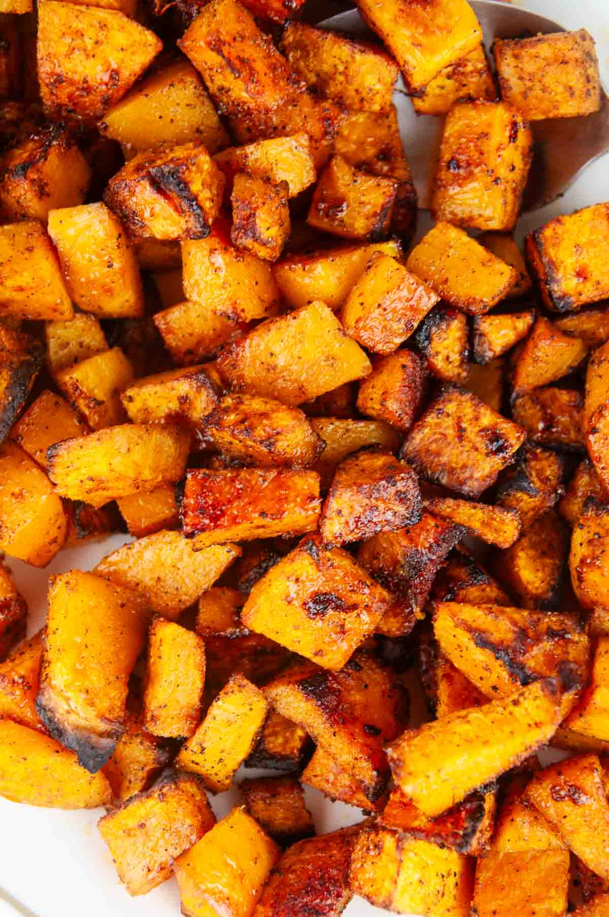 Roasted spice butternut squash is a savory butternut squash recipe with bold flavors like chili powder and garlic. This is a standout variation on traditional sweet roasted squash recipes!