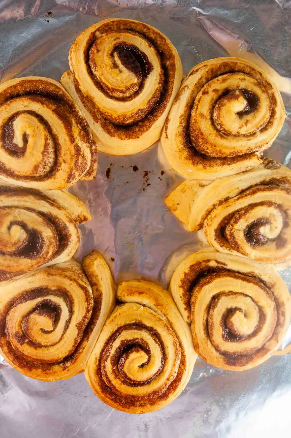 Bake the cinnamon roll wreath until the cinnamon rolls are golden brown.