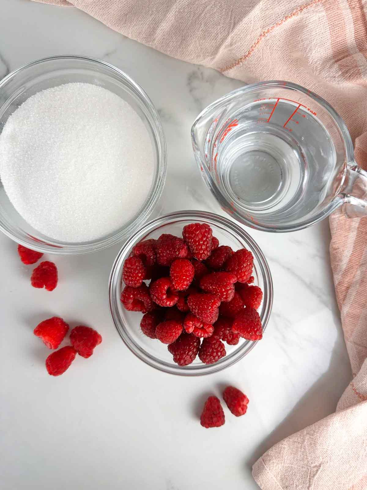 Ingredients for raspberry simple syrup for drinks: sugar, water, raspberries