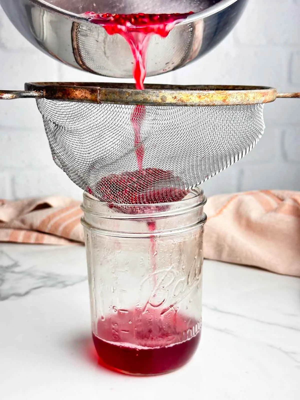 Strain the raspberry mixture.