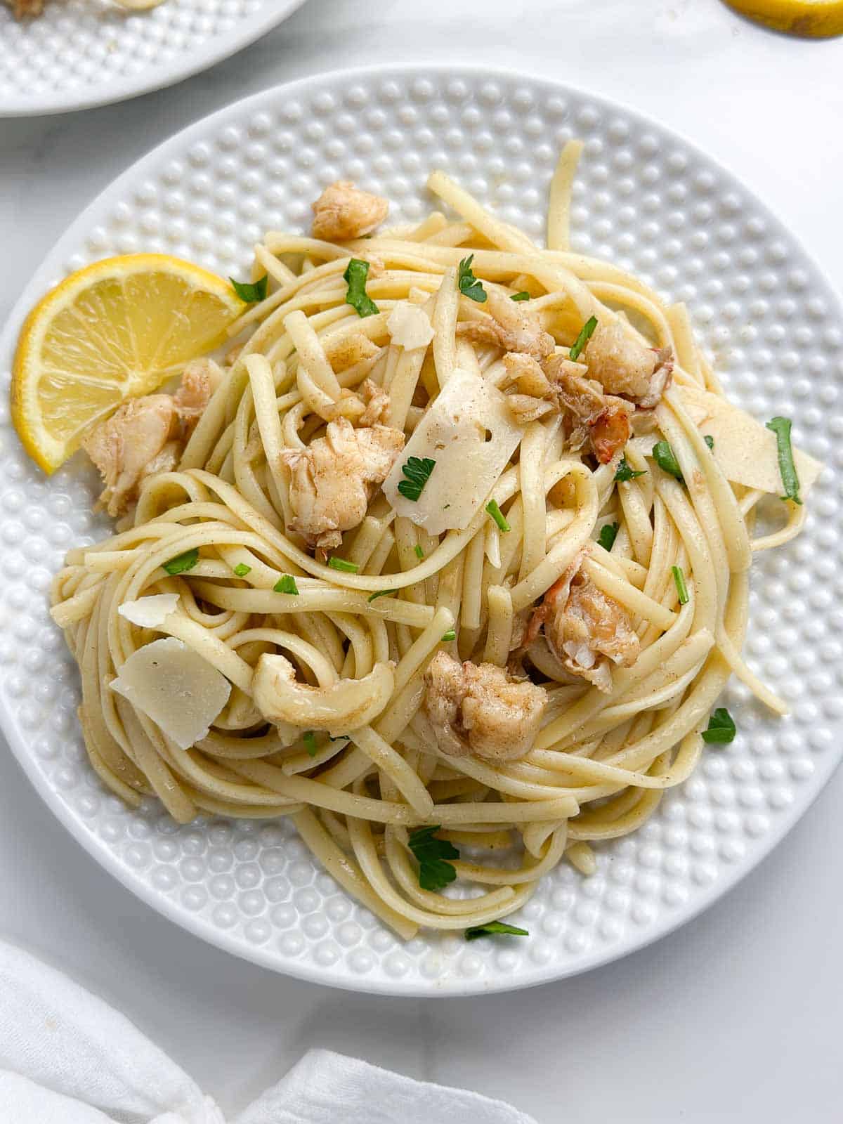 2 plates with brown butter lobster pasta