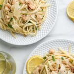 A photo of two plates of lobster pasta with decorative text reading brown butter lobster pasta