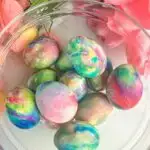 A bowl of marbled easter eggs set into a decorative text box reading Cool Whip Easter Eggs