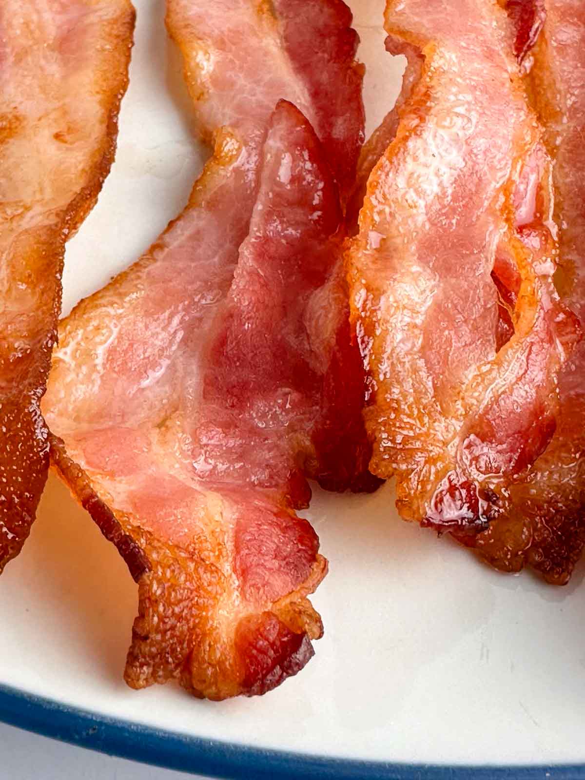 Close up of cooked bacon on a plate