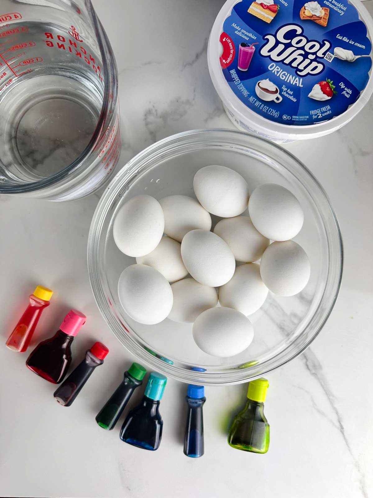Materials for Cool Whip Easter Eggs: Hard Boiled Eggs, Cool Whip, Vinegar, Food Coloring