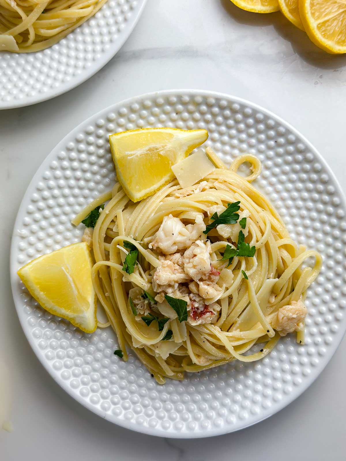 Two plates of lobster scampi linguine