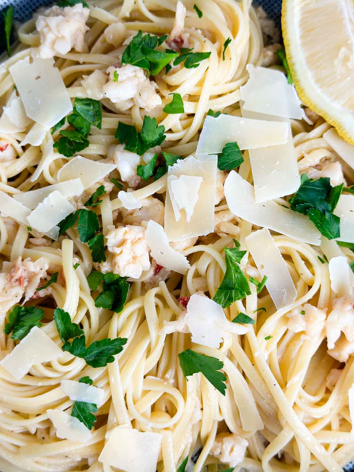Lobster scampi linguine topped with parmesan cheese, fresh parsley and extra lemon.