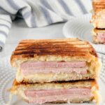 A photo of ham and cheese paninis set into a text box reading ham and cheese paninis