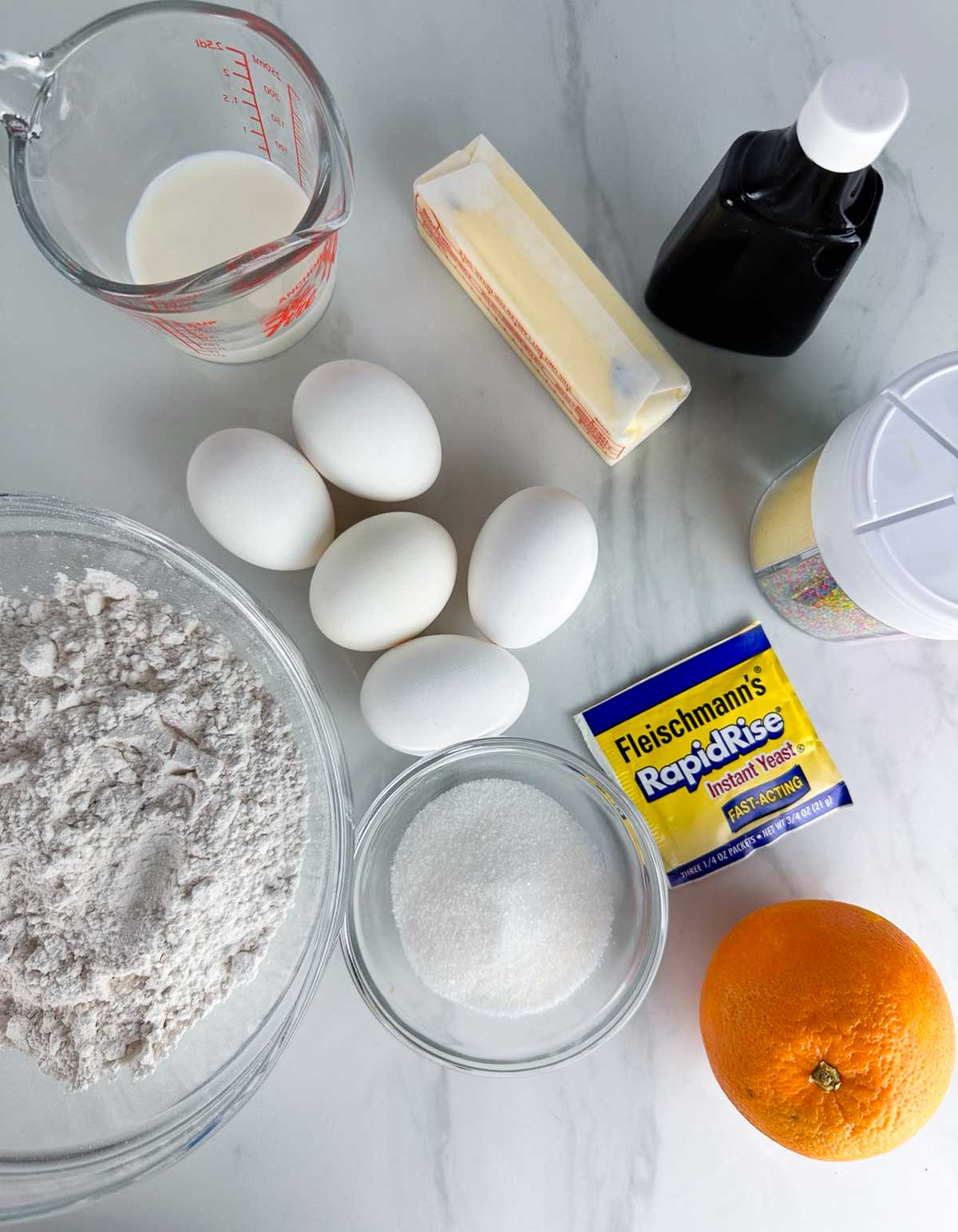 Italian Easter Bread Ingredients: Flour, Milk, Salt, Eggs, Butter, Zest, Vanilla, and Sprinkles