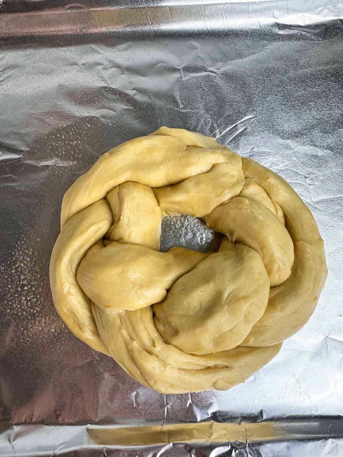 Shape the braided bread into a wreath shape.