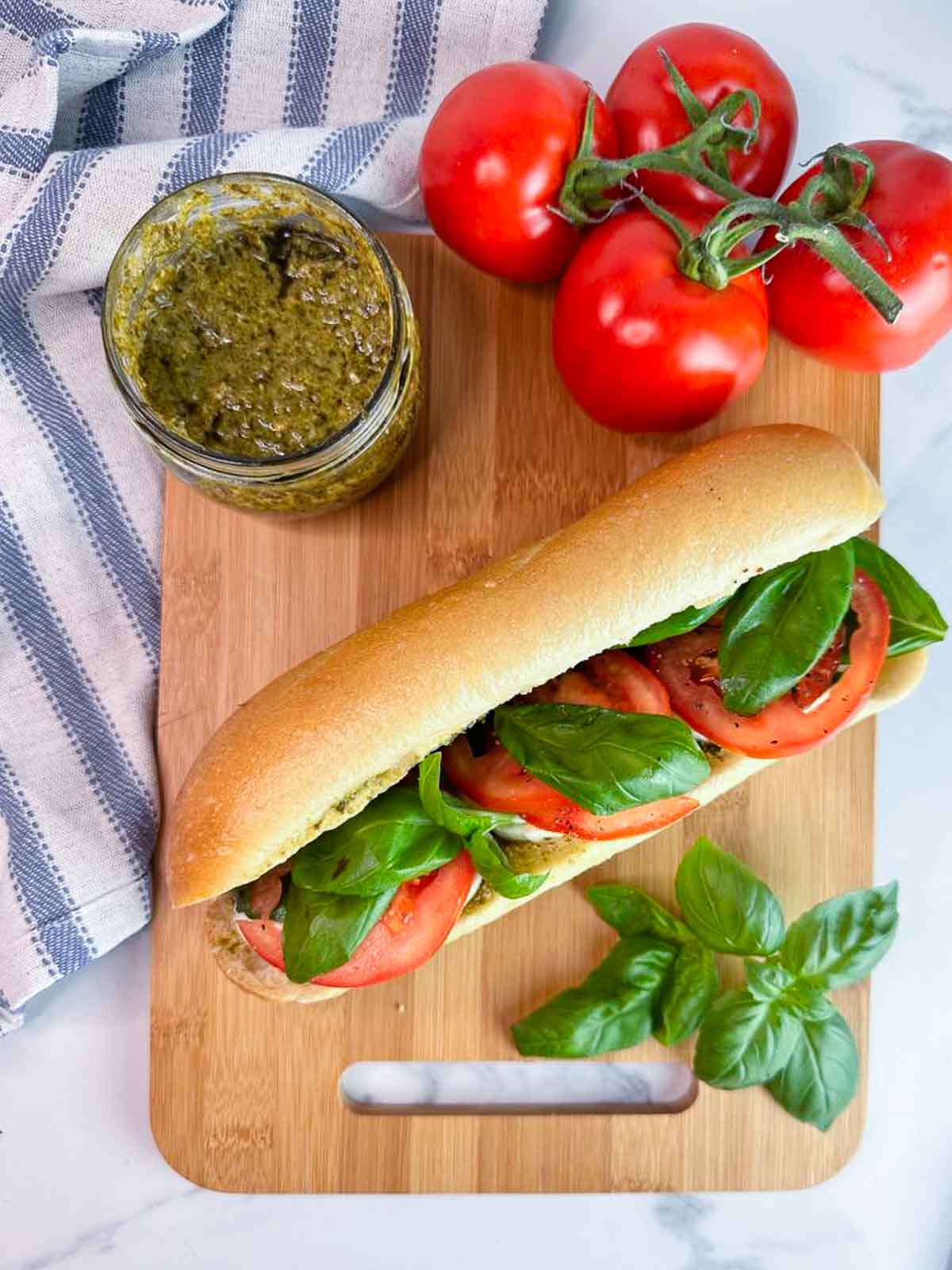 A caprese baguette sandwich with pesto is a delicious and easy lunch or dinner