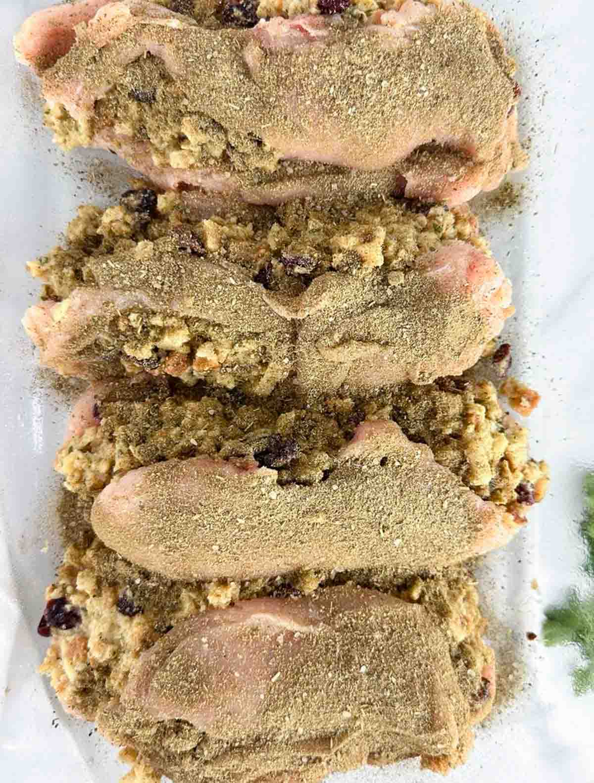 Season the stuffing stuffed chicken breasts with a blend of poultry seasoning, onion powder, garlic powder, and salt and pepper